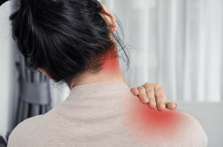 Backside of woman leaning to the left with red heat spots on upper neck near the ear and lower neck towards the shoulder that highlight the persons pain spots.