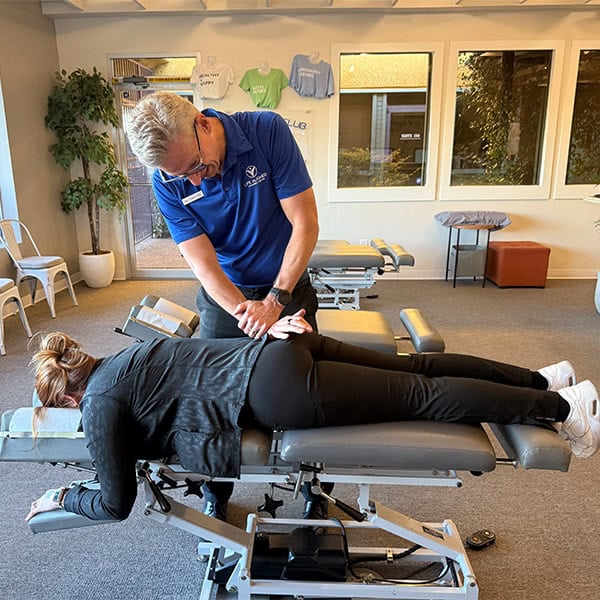 Tucson Chriopractor_Dr. Cox back chiropractic working on a patients lower back