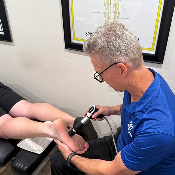 Dr.Cox doing shocktherapy on patients foot